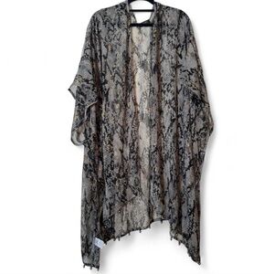 Elizabeth Gillet snake cover up